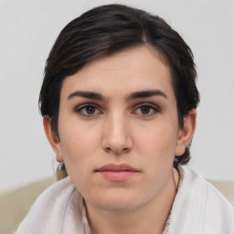 Neutral white young-adult female with short  brown hair and brown eyes