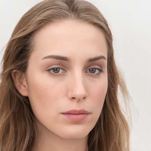 Neutral white young-adult female with long  brown hair and blue eyes