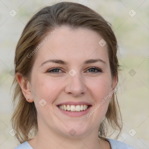 Joyful white young-adult female with medium  brown hair and blue eyes