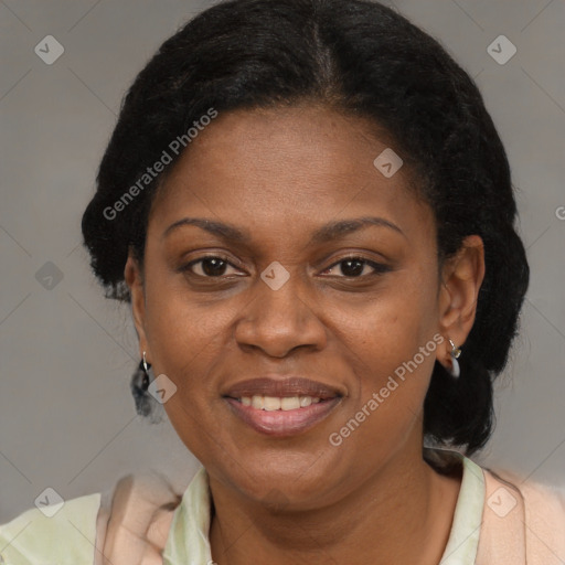 Joyful black adult female with short  brown hair and brown eyes