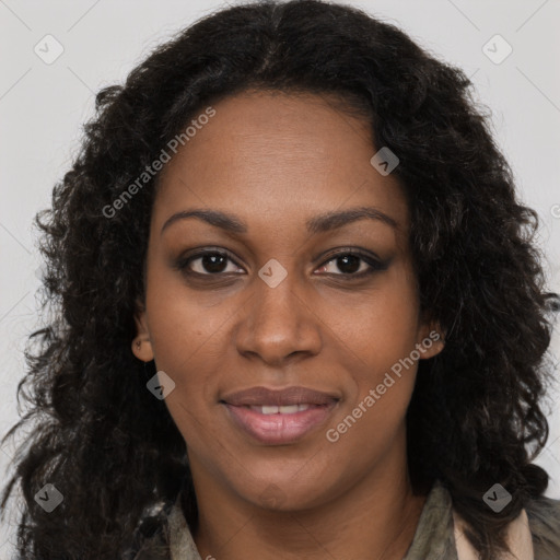 Joyful black young-adult female with long  brown hair and brown eyes