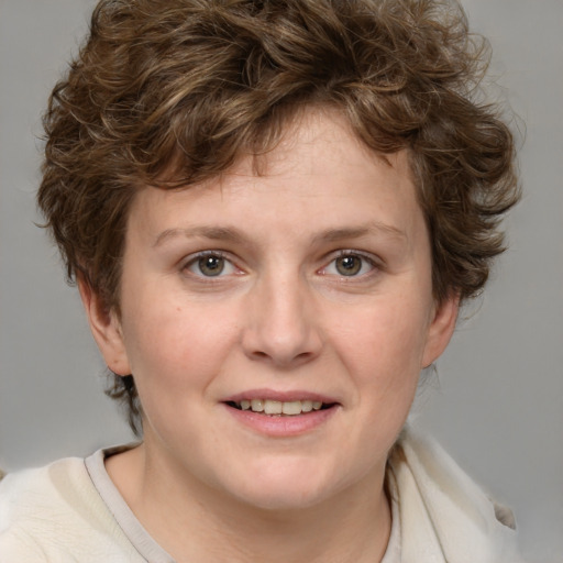 Joyful white young-adult female with medium  brown hair and blue eyes