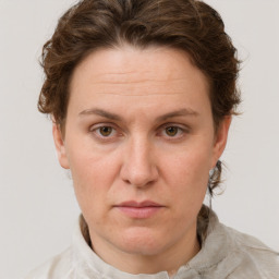 Joyful white adult female with short  brown hair and grey eyes