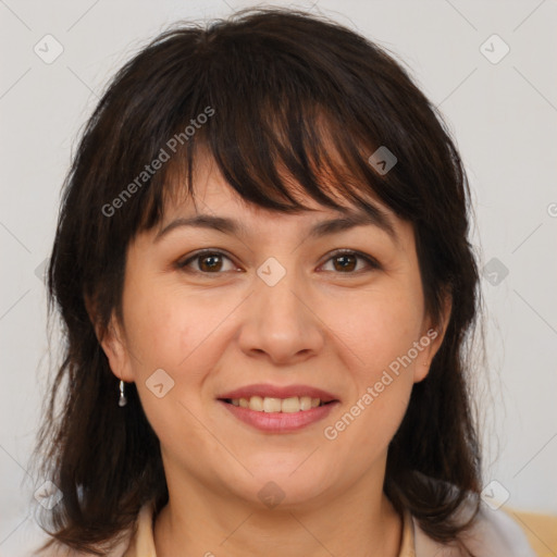 Joyful white adult female with medium  brown hair and brown eyes