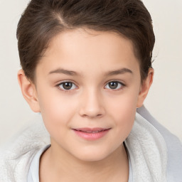 Joyful white child female with short  brown hair and brown eyes