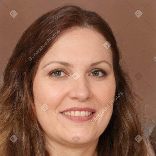 Joyful white adult female with long  brown hair and brown eyes