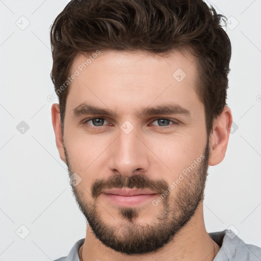 Neutral white young-adult male with short  brown hair and brown eyes