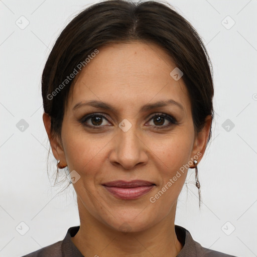 Joyful white adult female with medium  brown hair and brown eyes