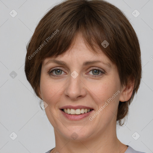 Joyful white adult female with medium  brown hair and grey eyes