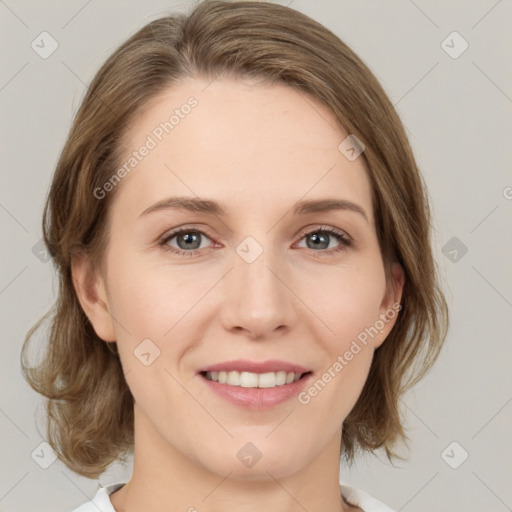 Joyful white young-adult female with medium  brown hair and green eyes