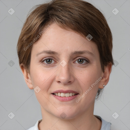 Joyful white young-adult female with short  brown hair and grey eyes