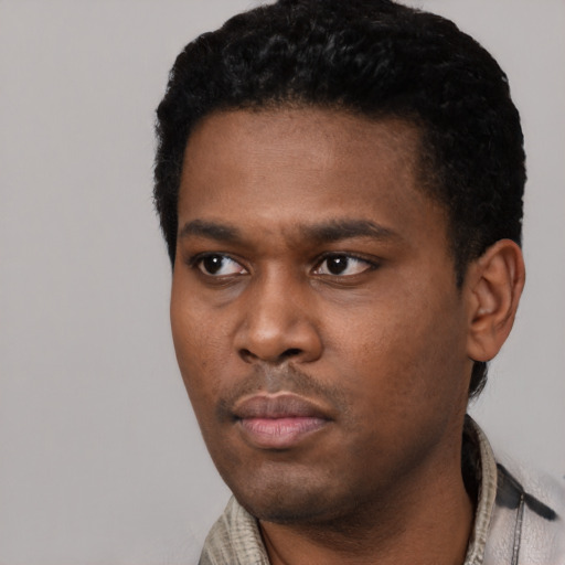 Neutral black young-adult male with short  black hair and brown eyes