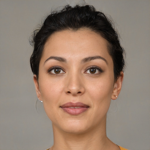 Joyful latino young-adult female with short  brown hair and brown eyes