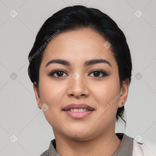 Joyful latino young-adult female with short  black hair and brown eyes