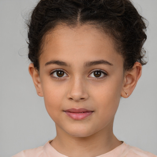 Joyful white child female with short  brown hair and brown eyes