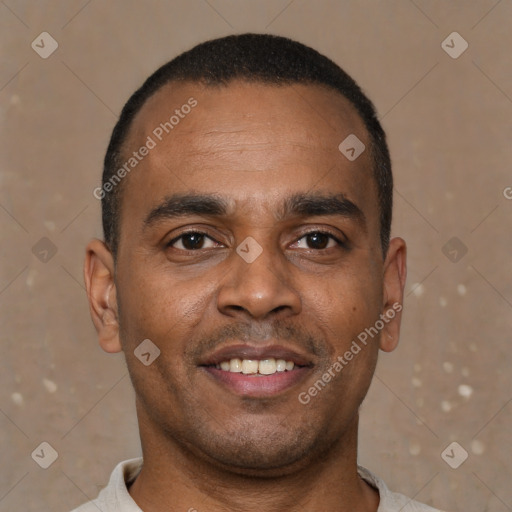 Joyful latino young-adult male with short  brown hair and brown eyes