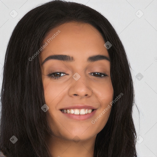 Joyful latino young-adult female with long  black hair and brown eyes