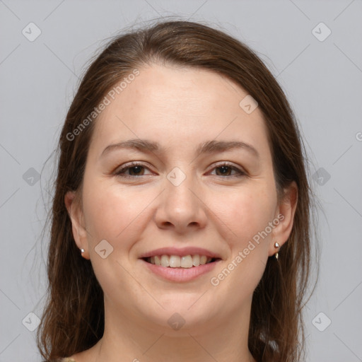 Joyful white young-adult female with medium  brown hair and grey eyes