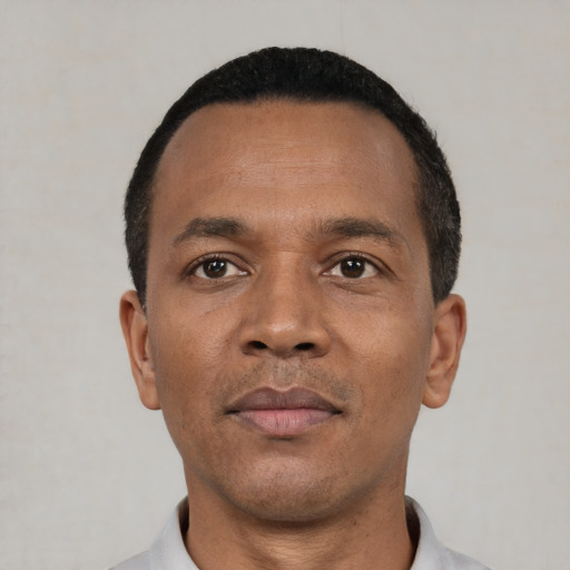 Neutral black young-adult male with short  black hair and brown eyes