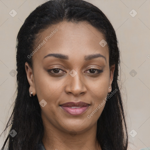 Joyful black young-adult female with long  brown hair and brown eyes