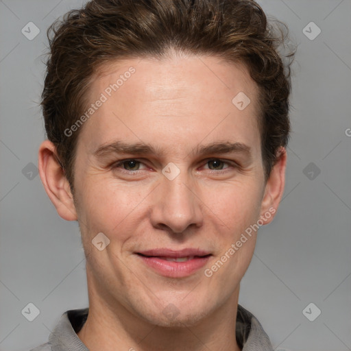 Joyful white adult male with short  brown hair and grey eyes