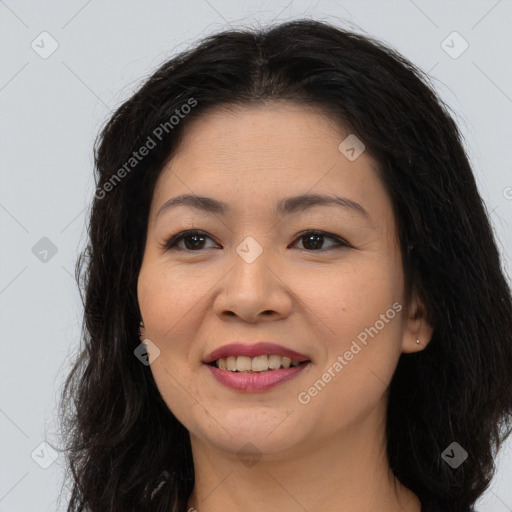 Joyful asian young-adult female with long  brown hair and brown eyes