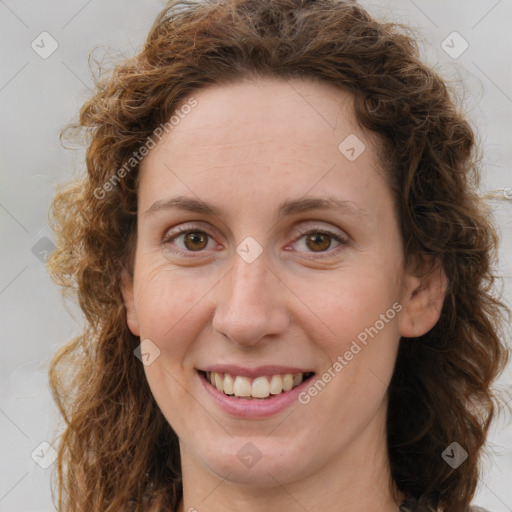 Joyful white young-adult female with medium  brown hair and green eyes