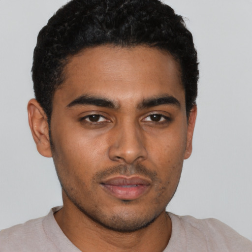 Neutral latino young-adult male with short  brown hair and brown eyes