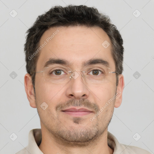 Joyful white adult male with short  brown hair and brown eyes