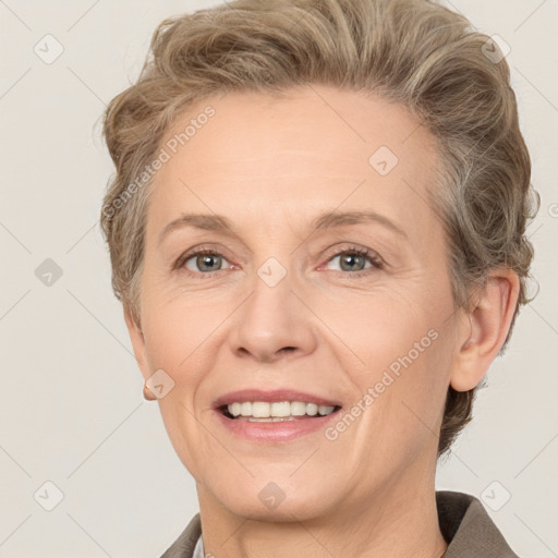 Joyful white adult female with short  brown hair and grey eyes