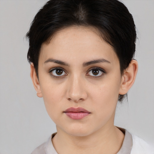 Neutral white young-adult female with medium  brown hair and brown eyes