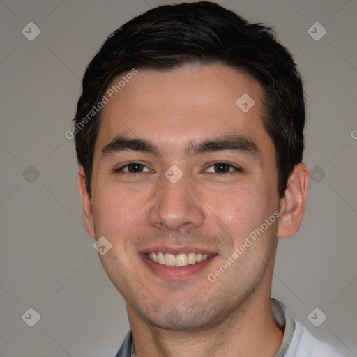 Joyful white young-adult male with short  black hair and brown eyes