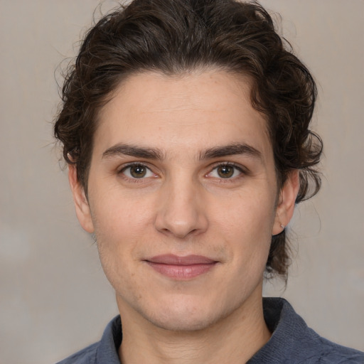 Joyful white young-adult male with medium  brown hair and brown eyes