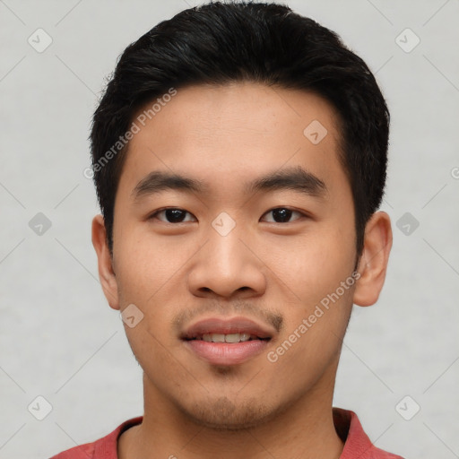 Joyful asian young-adult male with short  black hair and brown eyes