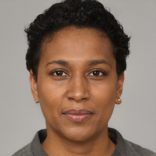 Neutral black adult female with short  black hair and brown eyes