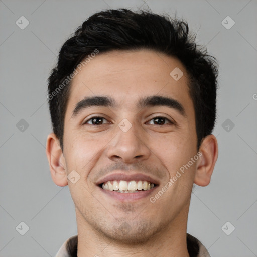 Joyful white young-adult male with short  black hair and brown eyes