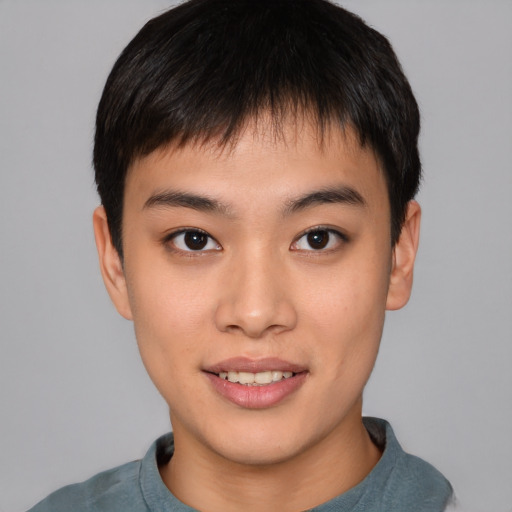 Joyful asian young-adult male with short  brown hair and brown eyes