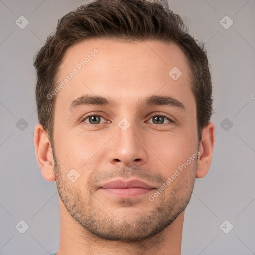 Joyful white young-adult male with short  brown hair and brown eyes