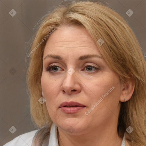 Joyful white adult female with long  brown hair and brown eyes