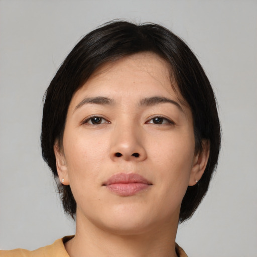 Neutral asian young-adult female with medium  brown hair and brown eyes
