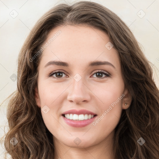 Joyful white young-adult female with long  brown hair and green eyes