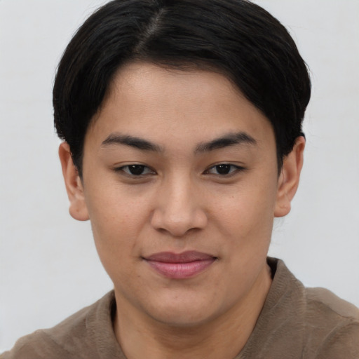 Joyful asian young-adult female with short  brown hair and brown eyes