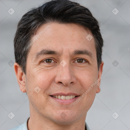 Joyful white adult male with short  brown hair and brown eyes