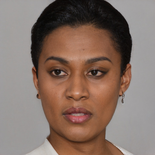 Neutral latino young-adult female with short  black hair and brown eyes
