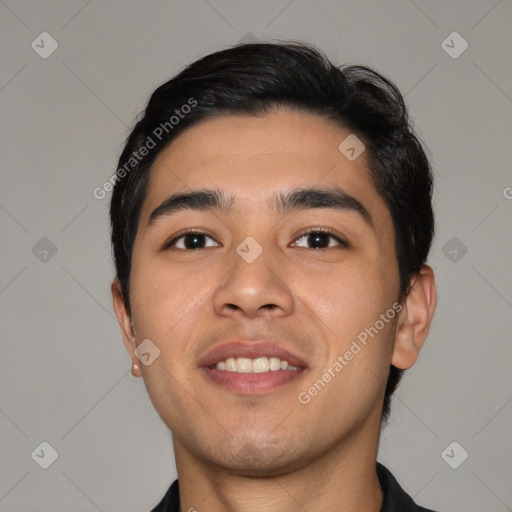 Joyful asian young-adult male with short  black hair and brown eyes