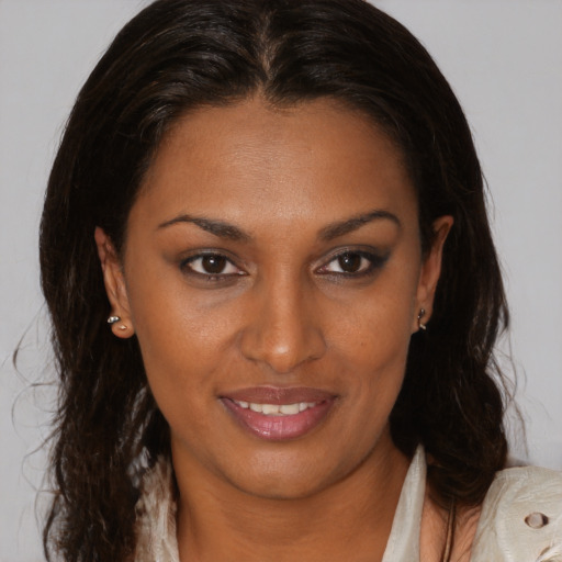 Joyful black young-adult female with medium  brown hair and brown eyes