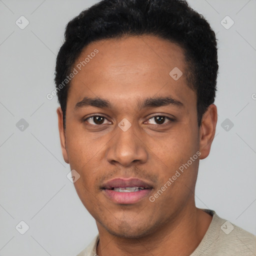 Joyful latino young-adult male with short  black hair and brown eyes