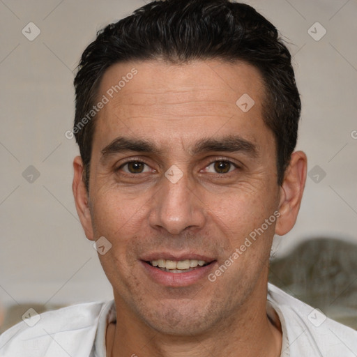 Joyful white adult male with short  brown hair and brown eyes