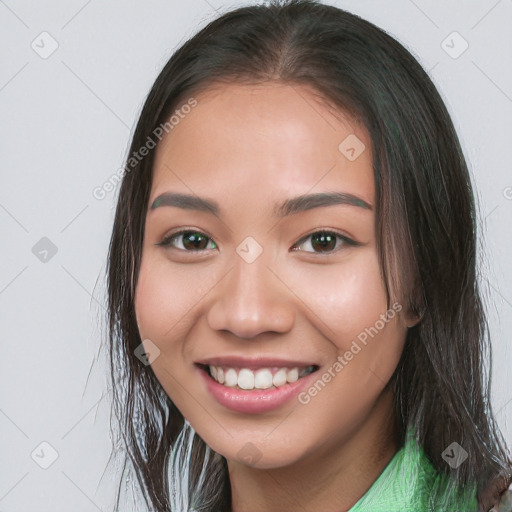 Joyful white young-adult female with long  brown hair and brown eyes