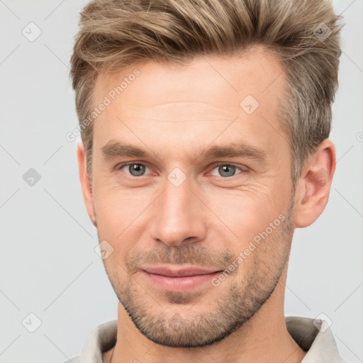 Joyful white adult male with short  brown hair and brown eyes